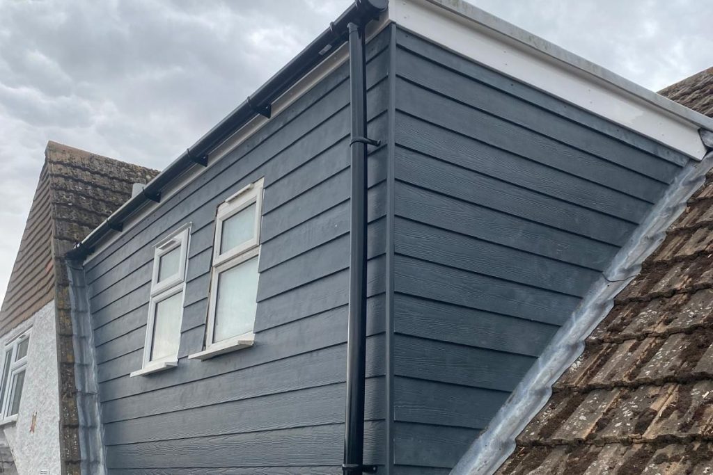 Finished grey Hardie Plank cladding installed by Ely Roofing Company in Norfolk